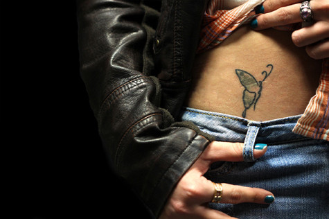 Fatima Serrate shows off her butterfly tattoo on her right hip. 