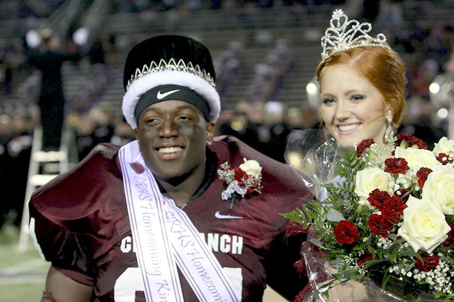 Seniors Tony Smith and Mary Ellen Hale enjoy their coronation as 2013 Homecoming King and Queen. Smith, a varsity co-captain and Hale, a varsity basketball player were crowned at halftime of the homecoming game against Morton Ranch. 