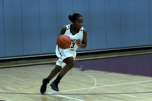 Junior Chanel OConnor dribbles upcourt in the game against Episcopal Dec. 6. Lady Cougars beat the spartans 65-36.
