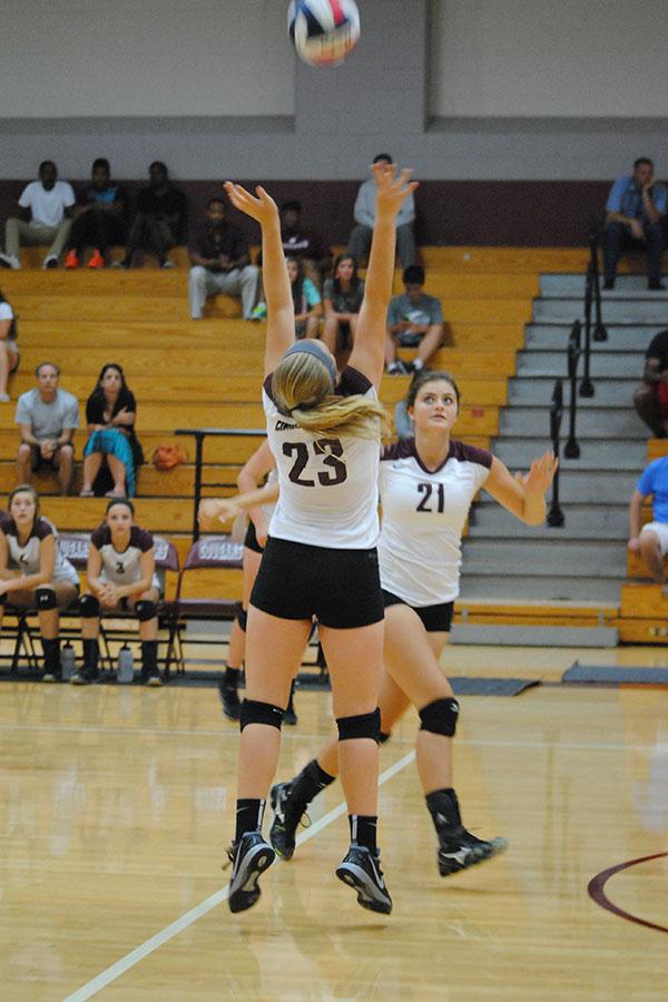 Sophomore+Audrey+Parker+sets+the+ball+for+sophomore+Madison+Bayer+in+the+JV+match+against+Cy-Fair+Aug.+12.