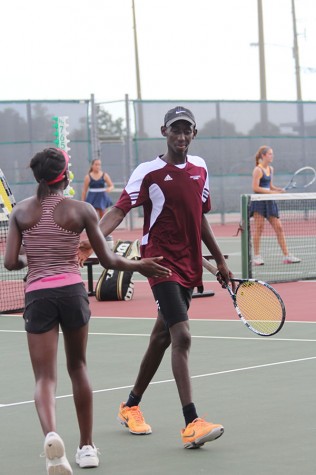 Siblings Yoma and Suvweh congratulate each other after a play during the district championship on September 30th.