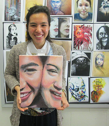Senior Isabella Phillips displays her artwork depicting her close bond with her sister Kari.