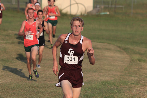 Senior Nathan Gift leads the pack in the 5K race at the Brenham Invitational finishing in 15:40.97.