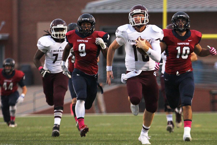 Senior QB Russell Morrison  leaves Tompkins defenders behind as he streaks for one of his two 50+ yard TD runs in the first half Thursday night at Rhodes Stadium. Morrison has gained over 1400 yards of total offense in the first six games of the season. Cinco improves to 6-0 on the year with a 3-0 district record.