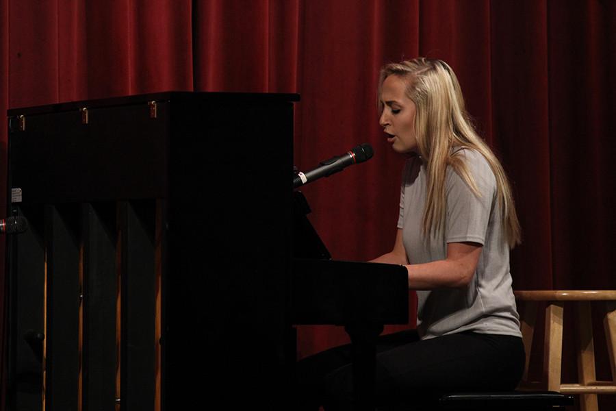 Senior Audrey Fogle plays the piano while performing One Republics Secrets.