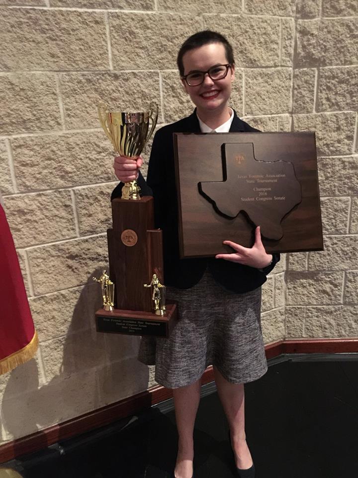 Sophomore Angela Lytle holds state trophy and plaque