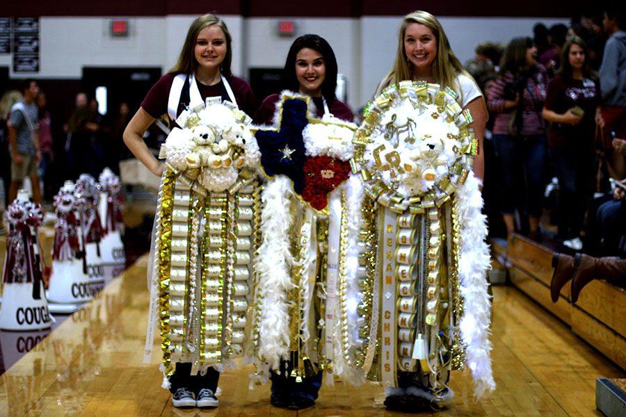 Students proudly display their mums at Fridays pep rally. Mums started out much smaller as actual flowers, Chrysanthemums, but they grew to be much larger in recent years. 