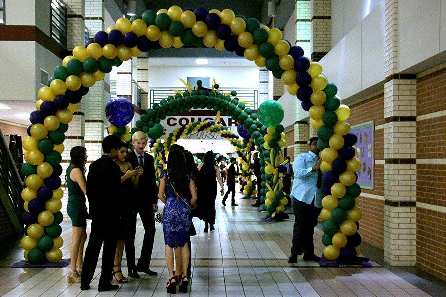 Students enter the dance through arches of balloons. Student Council decorated the school the Friday before and Saturday morning. 