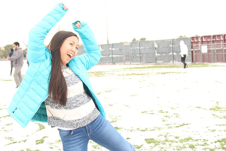 Senior Nicole Luu  celebrates the weather. Many students wanted to stay home, but Katy ISD announced that school would continue as normal early Friday morning.