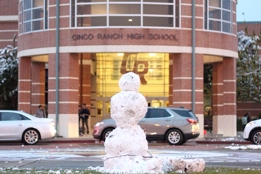 A snowman guards Cincos main entrance. Students gathered before school started to build the figure.