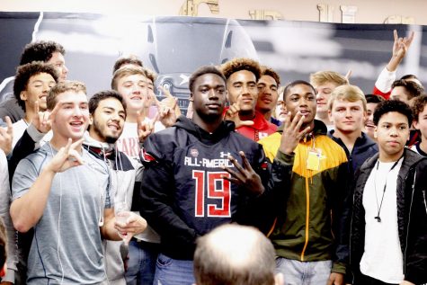 Gbenda is surrounded by teammates at his UnderArmour All-America Team jersey presentation ceremony Thursday.