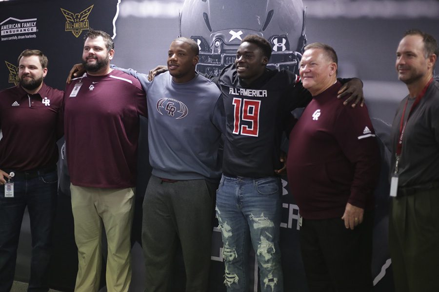 Senior David Gbenda enjoys a proud moment with his CRHS coaches at his UnderArmour All-America team jersey presentation Thursday in the LGI. Gbenda was selected as one of the top 100 players for the nationally televised all-star game Jan.3 in Orlando.