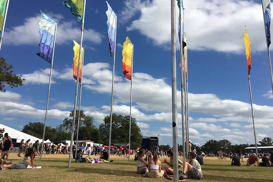 Throughout the festival, groups use the large sections of flags in Zilker Park as a common meeting place.