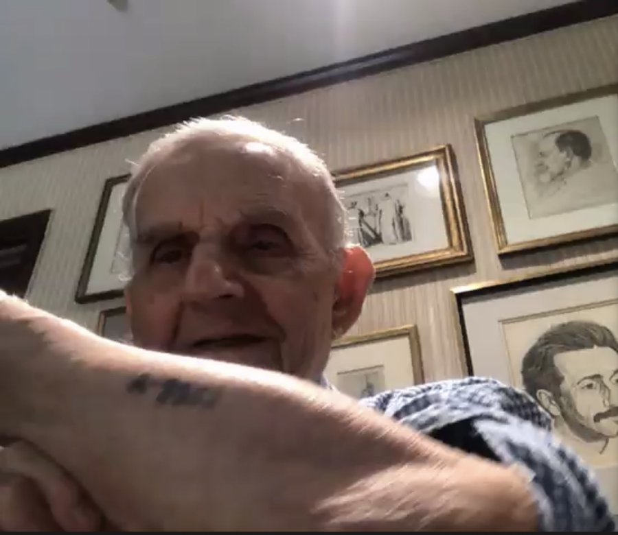 Holocaust survivor Erwin Forley displays his Aushwitz number, A9957, to the School of the New York Times students on June 17 via Zoom.  