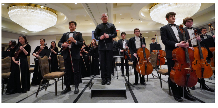 Sinfonia stands for applause after their Grand Champion Concert during the American String Teachers Association (ASTA) National Orchestra Festival.