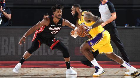 Lebron James (right) tries to dribble past Jimmy Butler (left).  Credit: NBAE via Getty Images
