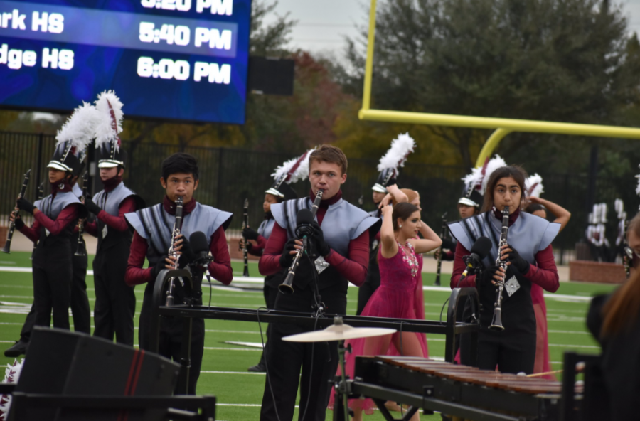 Senior Joseph Kohlmaier (middle) competes in a December marching band competition.